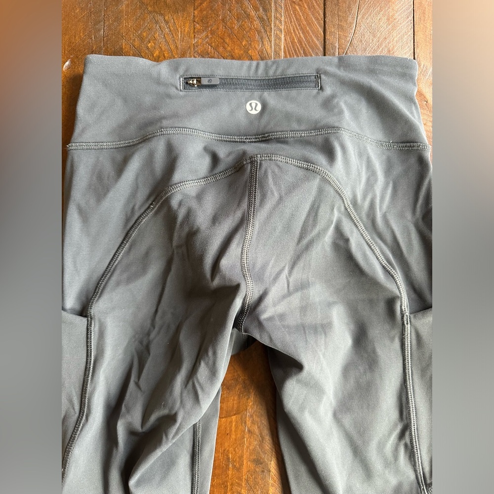 Lululemon size 4 women’s 7/8 length charcoal grey leggings